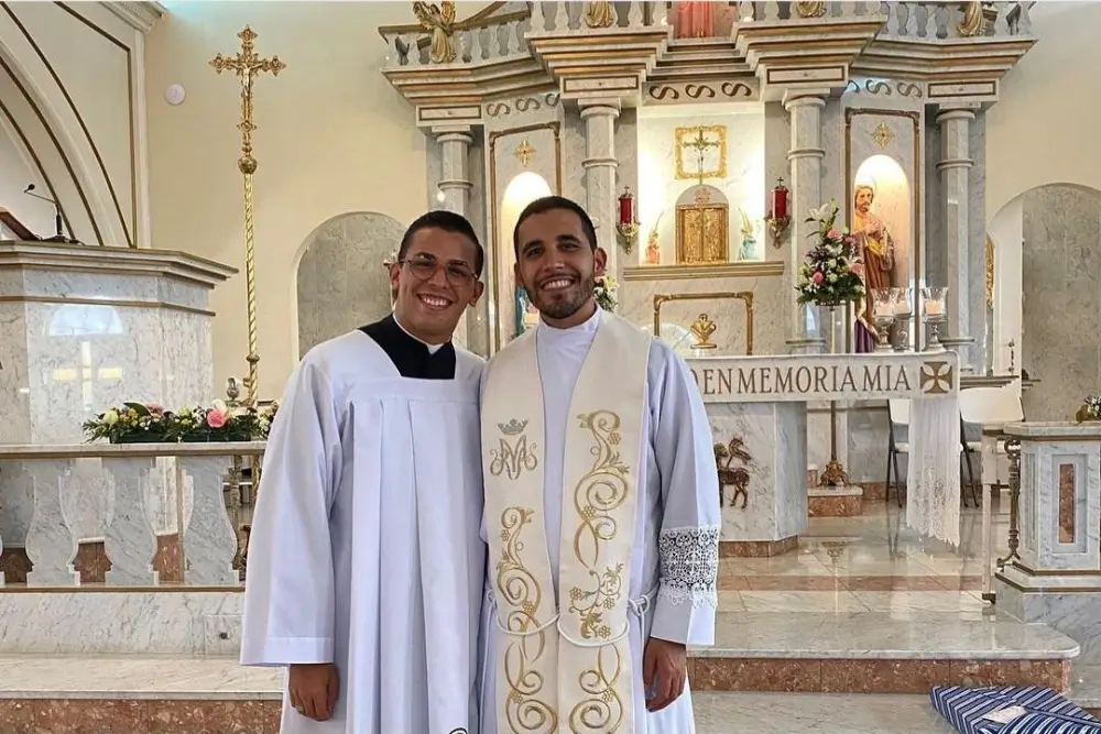 Two priests posing together